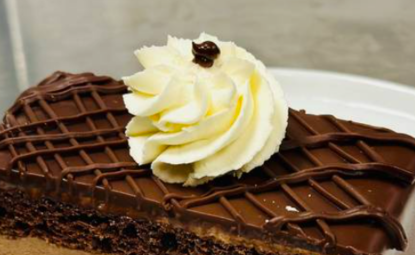 Slice of Chocolate Lava Cake with Cream on Top