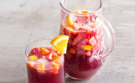 A Pitcher of A Red Non-Alcholic South American Mocktail with Fruits