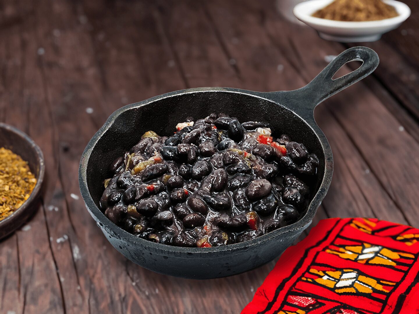 a black skillet with beans in it