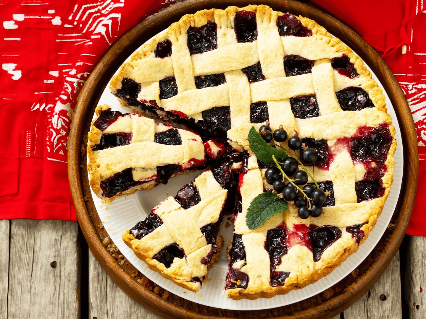 a pie with berries on a plate